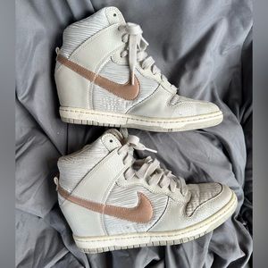 Elevate your sexy style w/ these Nike Dunk Sky Hi bone metallic bronze sneakers.